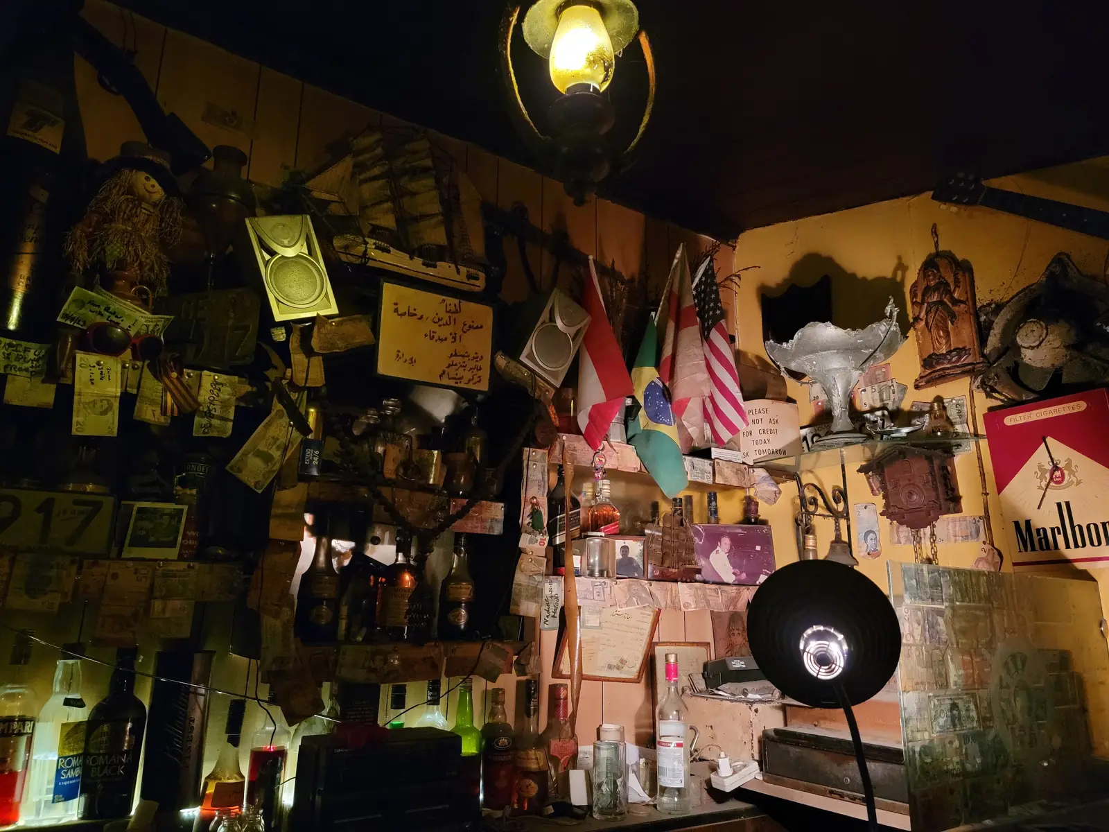 A wall of the bar covered end to end in handwritten names, dates and messages from decades of customers